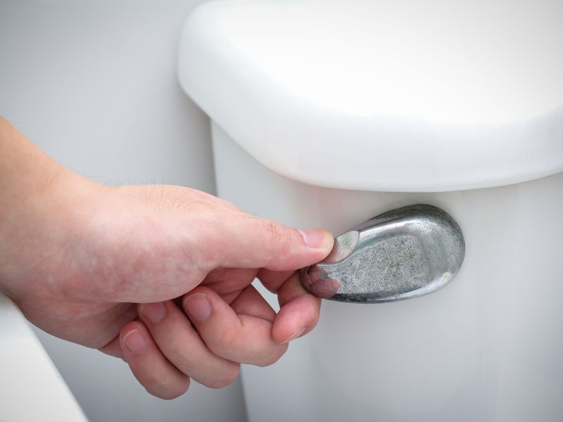 Flushing a Public Toilet? Be Sure to Wear a Mask