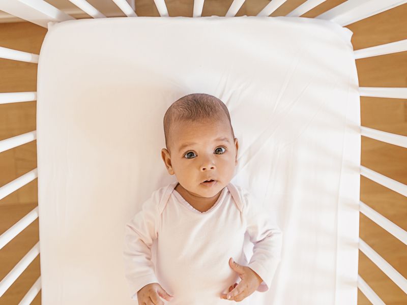 infant in crib