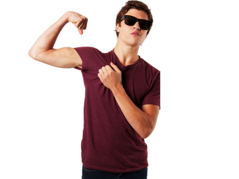teen flexing muscles